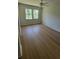 Neutral-toned bedroom with beautiful hardwood floors and natural light at 1978 Fisher Trl, Atlanta, GA 30345