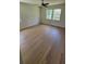 Bright bedroom featuring hardwood floors and a modern ceiling fan at 1978 Fisher Trl, Atlanta, GA 30345