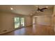 Bright living room with hardwood floors, vaulted ceiling, recessed lighting, and large window at 1978 Fisher Trl, Atlanta, GA 30345