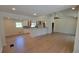 Open-concept living room with hardwood floors, vaulted ceiling, and kitchen with modern appliances at 1978 Fisher Trl, Atlanta, GA 30345