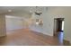 Spacious living room featuring hardwood floors, vaulted ceiling, and modern open layout to kitchen at 1978 Fisher Trl, Atlanta, GA 30345