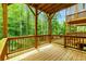 Spacious wood deck with sturdy supports and a view of the serene surrounding woods at 2006 Towneship Trl, Roswell, GA 30075