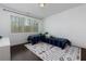 Well lit bedroom with hardwood floors, large window, and modern decor at 2006 Towneship Trl, Roswell, GA 30075