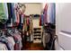 Walk-in closet complete with shelving and hanging space at 2006 Towneship Trl, Roswell, GA 30075