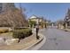 Gated community entrance with manicured landscaping and stone accents at 2006 Towneship Trl, Roswell, GA 30075
