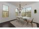 Dining area with a modern chandelier, neutral colors, and bright natural light at 2006 Towneship Trl, Roswell, GA 30075