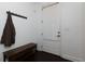 Functional entryway with coat rack, bench, and a door with a window for natural light at 2006 Towneship Trl, Roswell, GA 30075
