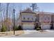 Inviting brick townhome with a two-car garage, set in a well-maintained community at 2006 Towneship Trl, Roswell, GA 30075