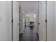 Open hallway with dark hardwood floors, connecting to a bright office space with natural light at 2006 Towneship Trl, Roswell, GA 30075