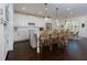Bright kitchen with white cabinets, stainless steel appliances, pendant lighting, and a center island with seating at 2006 Towneship Trl, Roswell, GA 30075