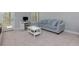 Cozy living room featuring a sofa, desk, and access to a balcony at 2006 Towneship Trl, Roswell, GA 30075