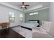Inviting main bedroom featuring dark wood floors, a tray ceiling, and a cozy sitting area with great natural light at 2006 Towneship Trl, Roswell, GA 30075