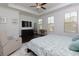 Serene main bedroom showcasing dark wood floors, a tray ceiling, and large windows for great natural light at 2006 Towneship Trl, Roswell, GA 30075