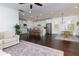 Spacious open-concept living area combining the kitchen, dining, and living spaces with hardwood floors at 2006 Towneship Trl, Roswell, GA 30075