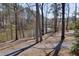 Scenic view of a pond with a fountain feature, surrounded by mature trees at 2006 Towneship Trl, Roswell, GA 30075