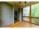 Cozy screened porch with views into home and surrounding woods at 2006 Towneship Trl, Roswell, GA 30075