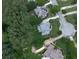 An aerial shot captures lush greenery, stately homes, and curving streets, creating a serene neighborhood atmosphere at 414 Candler Trl, Canton, GA 30115