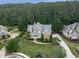 An inviting home showcasing a beautiful front yard, brick accents, and a well-manicured landscape in an aerial view at 414 Candler Trl, Canton, GA 30115