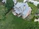 Stunning aerial view featuring a spacious backyard, a covered deck, and a well-maintained home exterior at 414 Candler Trl, Canton, GA 30115