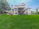 Expansive backyard with a wooden deck, patio, and a cozy fire pit for outdoor entertaining at 414 Candler Trl, Canton, GA 30115