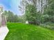 Well-maintained backyard featuring a storage shed and mature trees at 414 Candler Trl, Canton, GA 30115