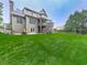 Lush green backyard featuring a multilevel deck and outdoor entertaining space at 414 Candler Trl, Canton, GA 30115