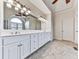 Bathroom with double vanity, large mirror, and tile flooring at 414 Candler Trl, Canton, GA 30115