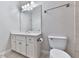 Bathroom featuring a vanity with white cabinets, a large mirror, and a toilet at 414 Candler Trl, Canton, GA 30115