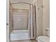 Bathroom featuring a shower and tub combo with a shower curtain, and a toilet at 414 Candler Trl, Canton, GA 30115
