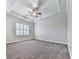 Inviting bedroom featuring plush carpeting, a ceiling fan, and plantation shutters allowing for adjustable natural light at 414 Candler Trl, Canton, GA 30115