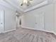 Spacious bedroom with tray ceilings, ceiling fan, neutral walls, and plush carpet flooring at 414 Candler Trl, Canton, GA 30115