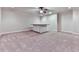 Versatile carpeted bonus room with an island, neutral walls, and recessed lighting at 414 Candler Trl, Canton, GA 30115