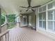 Relaxing covered deck with ceiling fans, views of lush yard, and access to home, great for entertaining at 414 Candler Trl, Canton, GA 30115