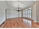 Bright dining room with hardwood floors, decorative molding, and large windows with plantation shutters at 414 Candler Trl, Canton, GA 30115