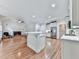 Gourmet kitchen boasts stainless appliances, a cozy fireplace, and hardwood floors at 414 Candler Trl, Canton, GA 30115