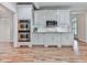 Modern kitchen features stainless steel appliances and sleek white cabinetry at 414 Candler Trl, Canton, GA 30115