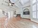 Bright and open living room with hardwood floors, coffered ceilings, and a fireplace at 414 Candler Trl, Canton, GA 30115