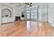 Bright and open living room with coffered ceilings, hardwood floors and large bay window at 414 Candler Trl, Canton, GA 30115