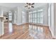 Spacious living room boasts hardwood floors, large windows with plantation shutters, and white trim at 414 Candler Trl, Canton, GA 30115