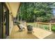Wood back deck with seating and a view of the lush, fenced-in backyard at 4469 Huntington Cir, Atlanta, GA 30338