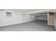 Unfinished basement with painted concrete walls and floors, and multiple windows for natural light at 4469 Huntington Cir, Atlanta, GA 30338