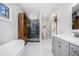 Bright bathroom with luxurious tub, walk-in shower, and elegant vanity at 4469 Huntington Cir, Atlanta, GA 30338