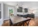 Cozy dining area with view into a gray kitchen and a wooden dining table at 4469 Huntington Cir, Atlanta, GA 30338