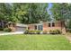 Beautiful ranch style house with fresh green lawn and a 2 car garage at 4469 Huntington Cir, Atlanta, GA 30338