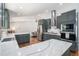 Gourmet kitchen featuring gray cabinetry, stainless steel appliances, and a spacious island at 4469 Huntington Cir, Atlanta, GA 30338