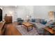 Bright living room featuring hardwood floors, exposed brick wall and comfortable seating at 4469 Huntington Cir, Atlanta, GA 30338