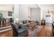 Comfortable living area with hardwood floors, painted brick, and stylish furnishings at 4469 Huntington Cir, Atlanta, GA 30338