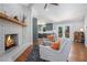 Open-concept living space with a fireplace, modern decor, and seamless flow to the kitchen at 4469 Huntington Cir, Atlanta, GA 30338
