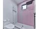 Modern bath with pink herringbone tile, glass shower, matte black hardware, and neutral color scheme at 106 Belmont Dr, Canton, GA 30115