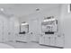 Elegant bathroom featuring dual vanities with stone countertops and modern fixtures at 106 Belmont Dr, Canton, GA 30115